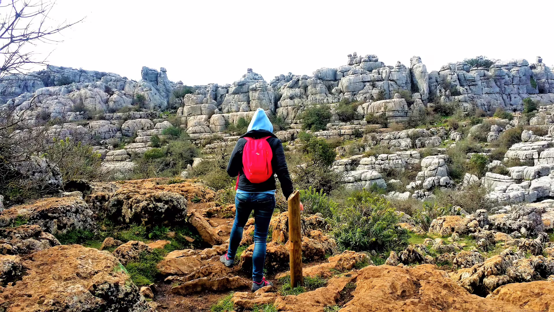 Hiker on El Torcal de Antequera trail, private tour with hotel pick-up to explore karst rock formations