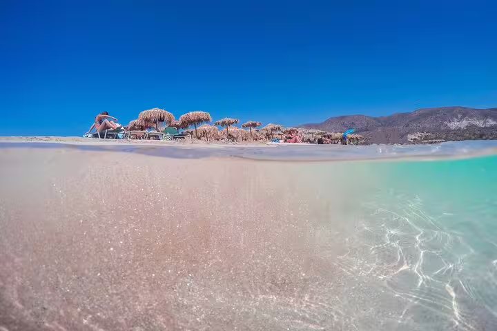 Crystal-clear waters and sandy shores of Elafonissi Beach, perfect for a relaxing day on a private tour from Rethymno.