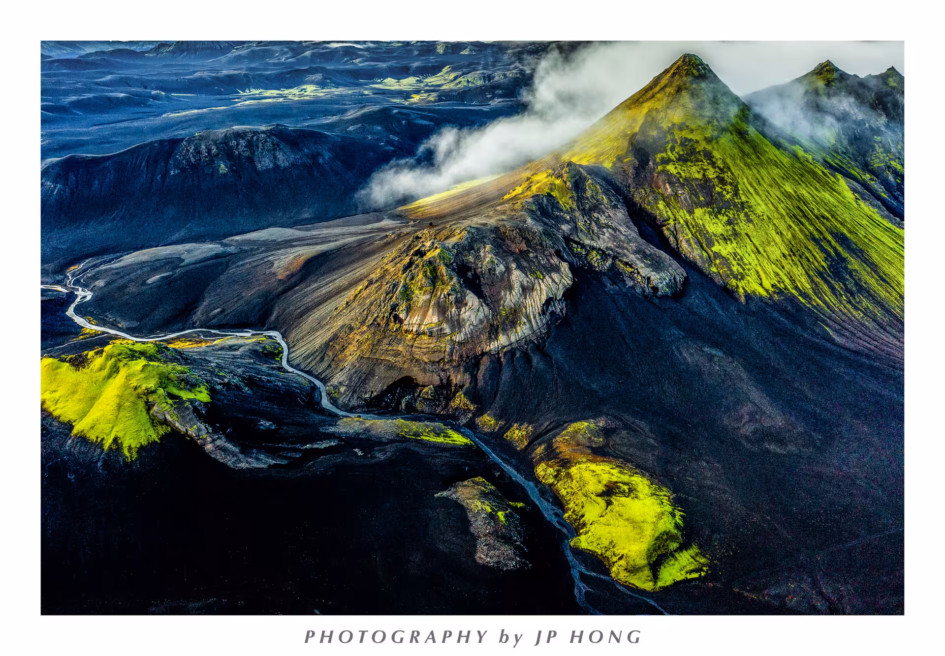 Aerial view of Eldgja canyon Iceland highlands with green moss-covered volcanic mountains and winding glacial river