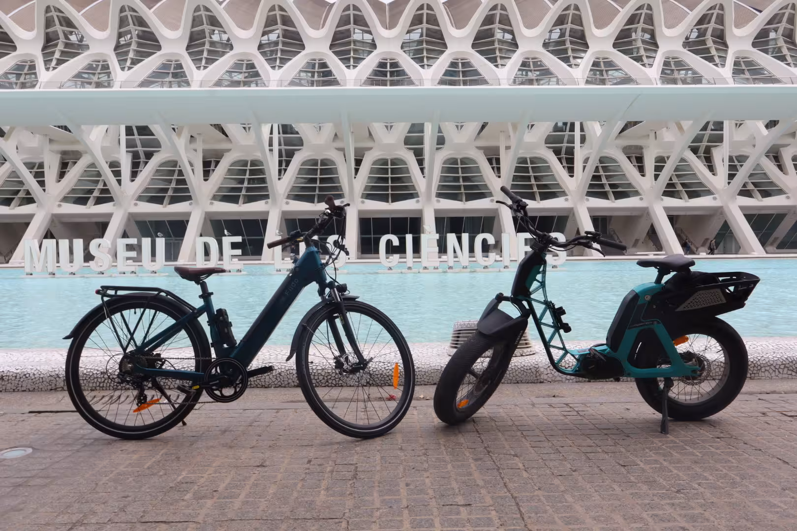 Two electric bikes for rent at Valencia Science Museum, great for exploring City of Arts and Sciences by e-bike