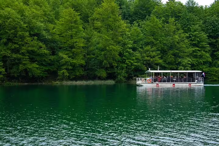 Electric boat ride on Plitvice Lakes National Park during guided group day trip from Split, Croatia