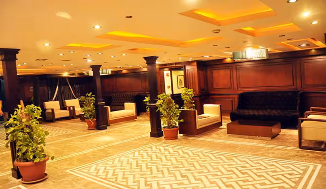 Elegant Nile dinner cruise lounge in Cairo with warm lighting, ideal for evening cruise with private transfer