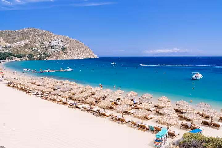 Elia Beach Mykonos with sunbeds and turquoise water, stop on Mykonos Highlights private tour for new explorers