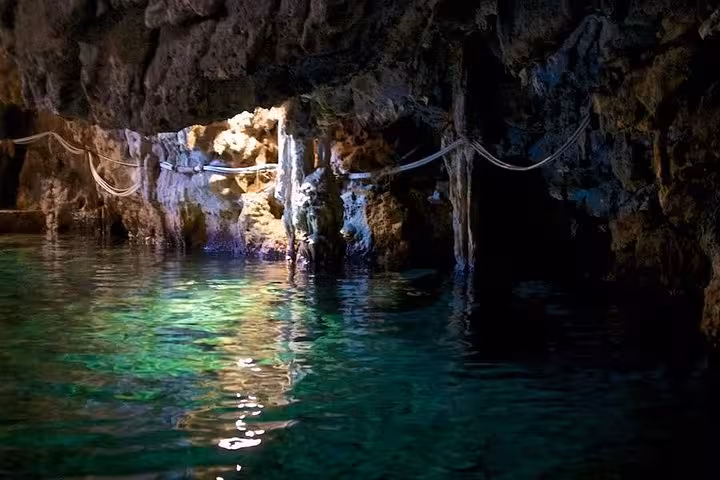 Marvel at the shimmering emerald waters and intricate rock formations of the Emerald Grotto on our full-day Amalfi tour.