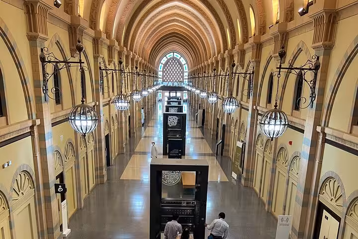 Arched museum corridor with chandeliers showcasing UAE history and culture on Emirates tours attractions itinerary