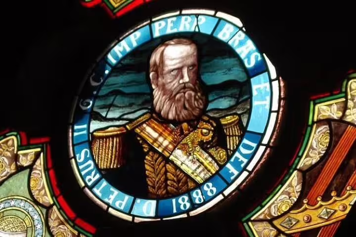 Intricate stained glass depicting Emperor Pedro II at the Fiscal Island palace on the Brazil Imperial Rio tour.