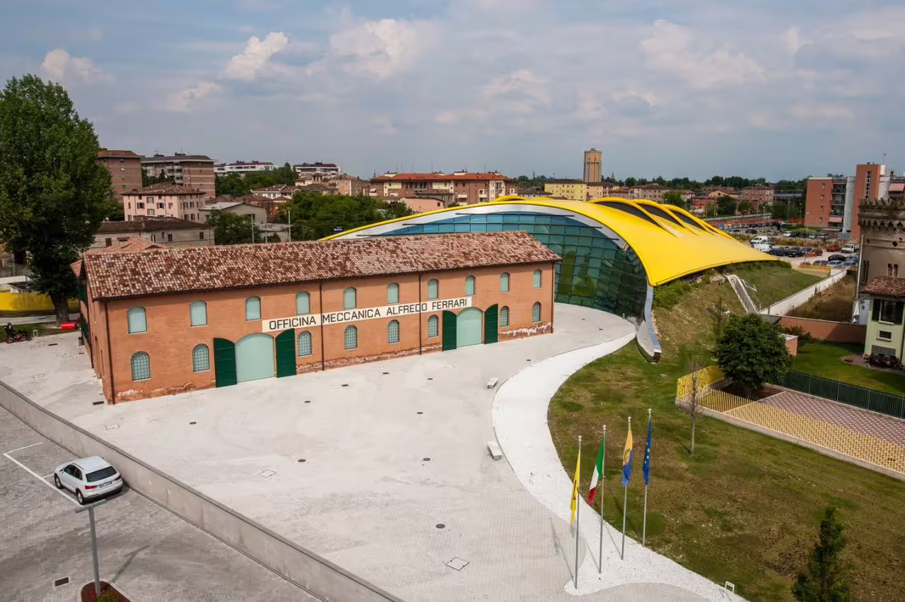 Enzo Ferrari Museum Modena with yellow roof, included on Modena bus transfer to Maranello and museum visit