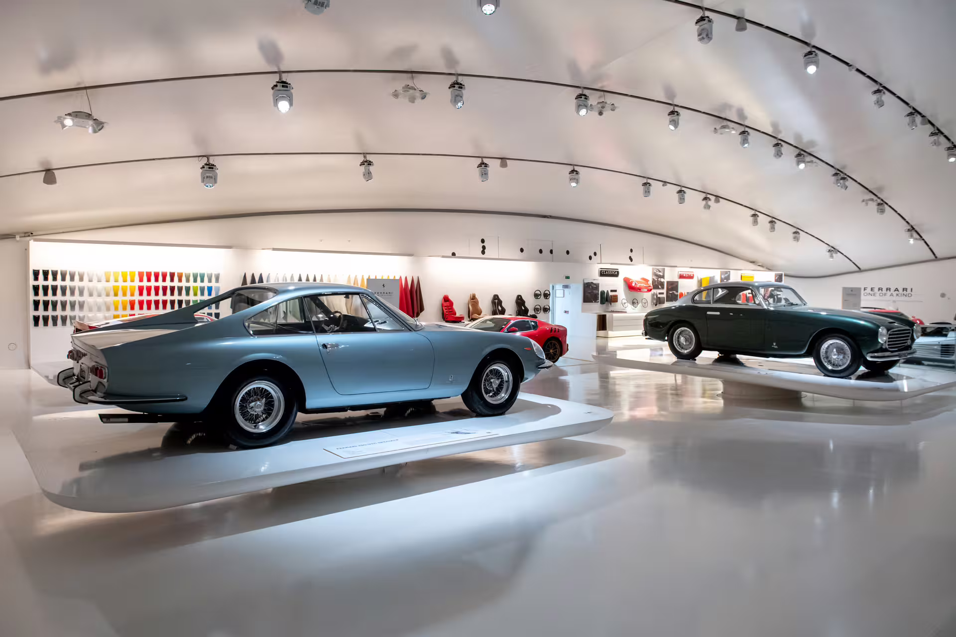 Classic Ferrari cars on display inside the Enzo Ferrari Museum Modena, included with entrance ticket