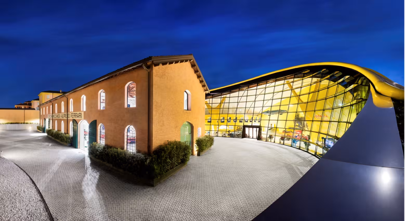 Enzo Ferrari Museum Modena exterior at dusk, included in Ducati Museum + Ferrari Museum combo tickets