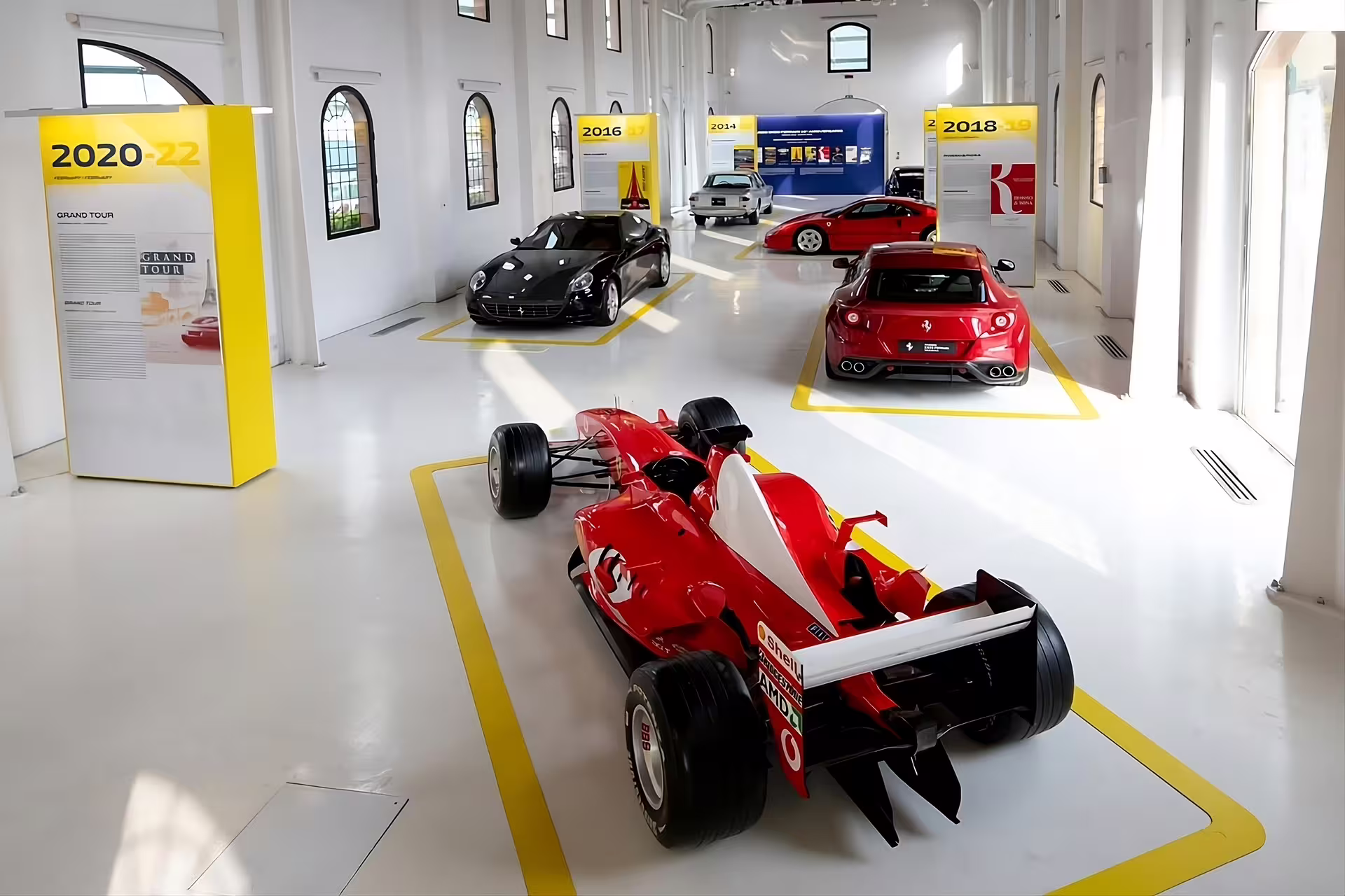 Ferrari F1 car and GT models in Enzo Ferrari Museum Modena exhibit hall, entrance ticket experience
