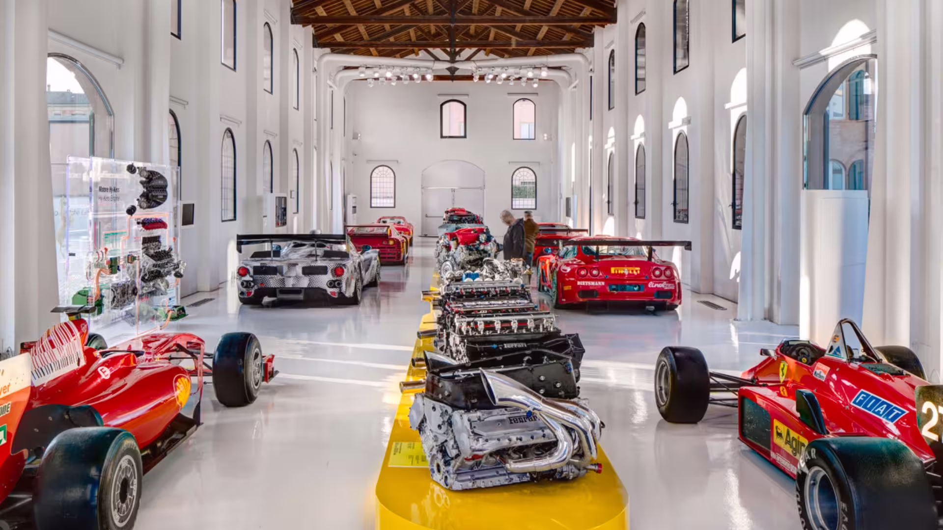 Historic Ferrari race cars and engine exhibit at Enzo Ferrari Museum Modena with skip-the-line entry