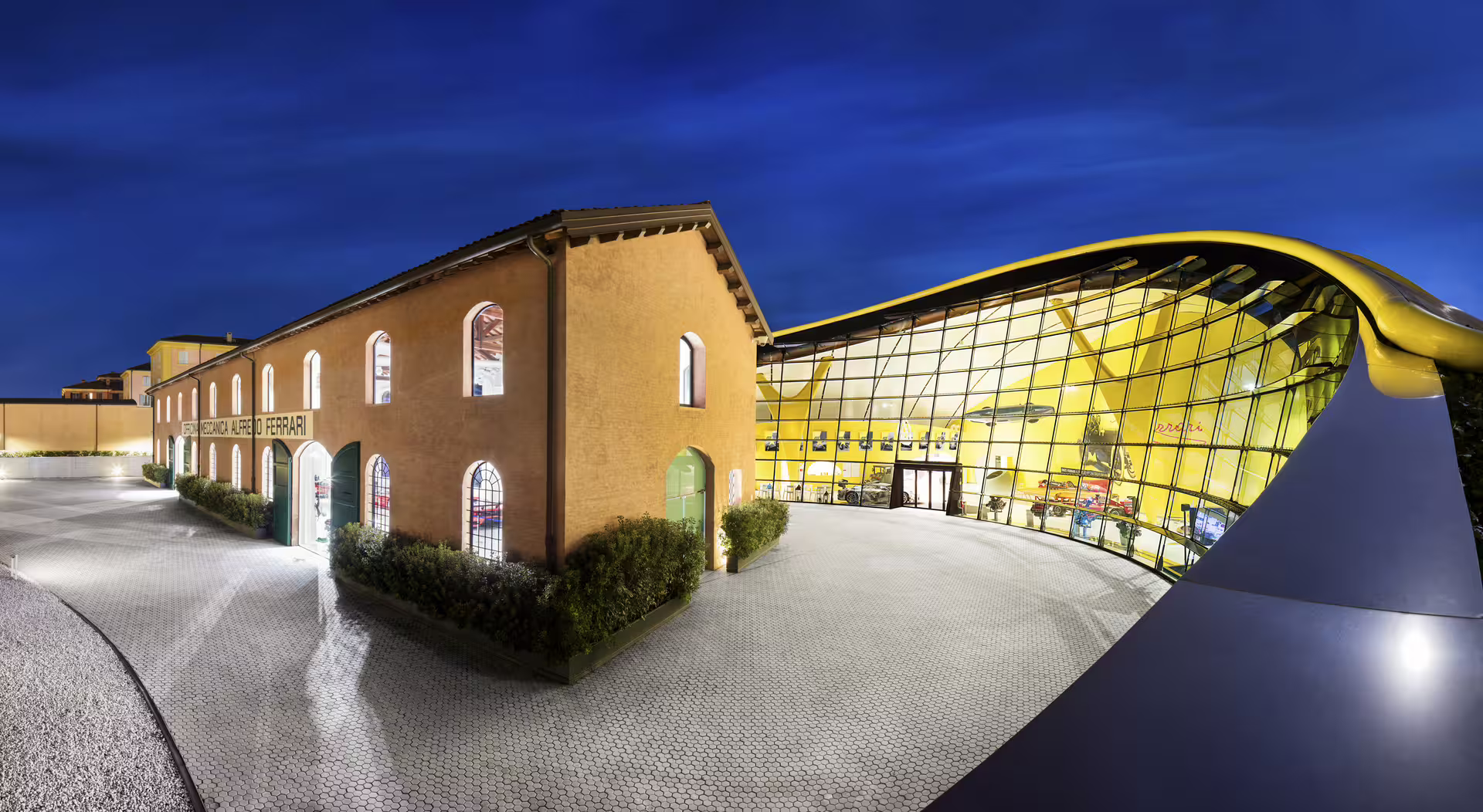 Night view of Enzo Ferrari Museum Modena exterior, part of Bologna Lamborghini and Ferrari museum entry ticket