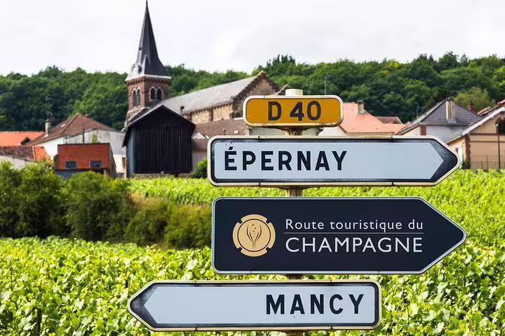 Épernay road sign on the Champagne tourist route amid vineyards, small-group day trip from Paris
