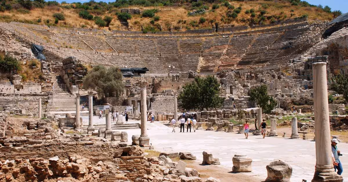 Ancient Ephesus amphitheater and marble street ruins, popular day trip on 5-day Istanbul Cappadocia itinerary