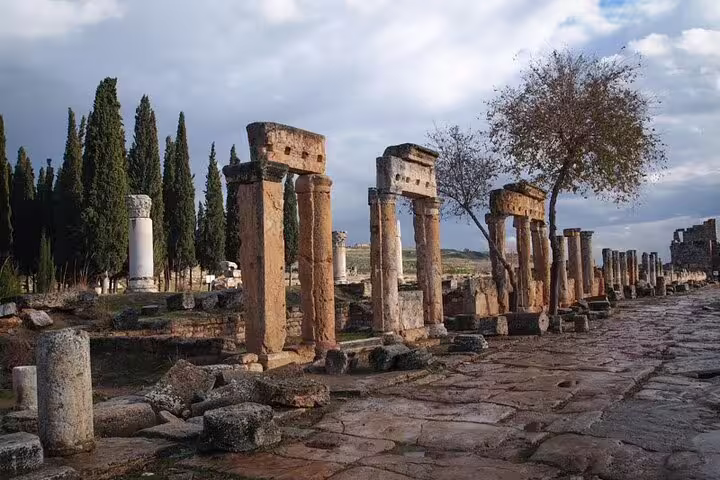 Ancient stone columns and pathway at Ephesus, a highlight of the 2 Days Ephesus & Pamukkale Tour from Istanbul.