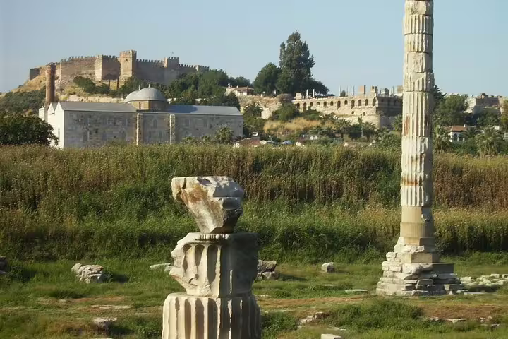 Ancient ruins and column near Selcuk Castle on Izmir to Ephesus full-day mini group tour with max 10 pax
