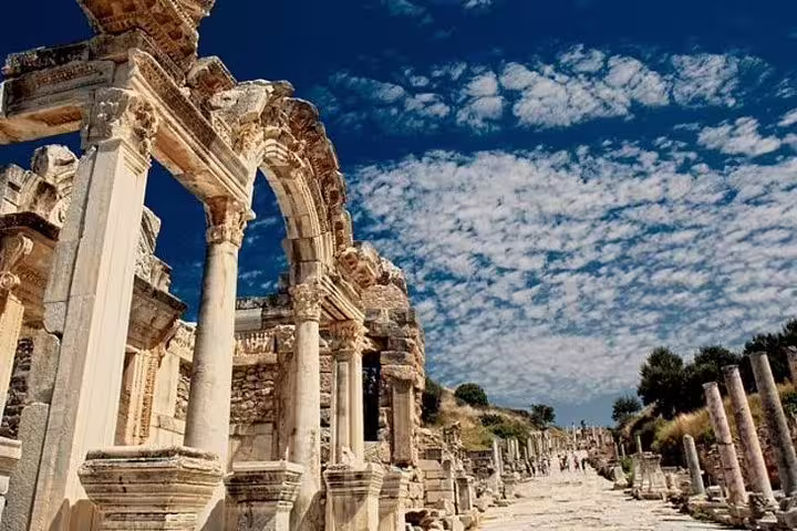 Stunning view of ancient Ephesus ruins under a vibrant sky, highlighting the grandeur of the site.