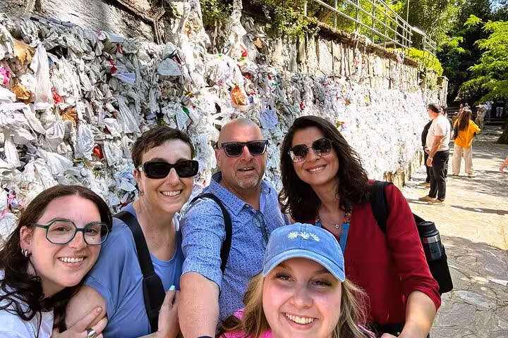 Tour guests on 2-day Ephesus Aphrodisias and Pamukkale tour posing by the House of Virgin Mary wish wall