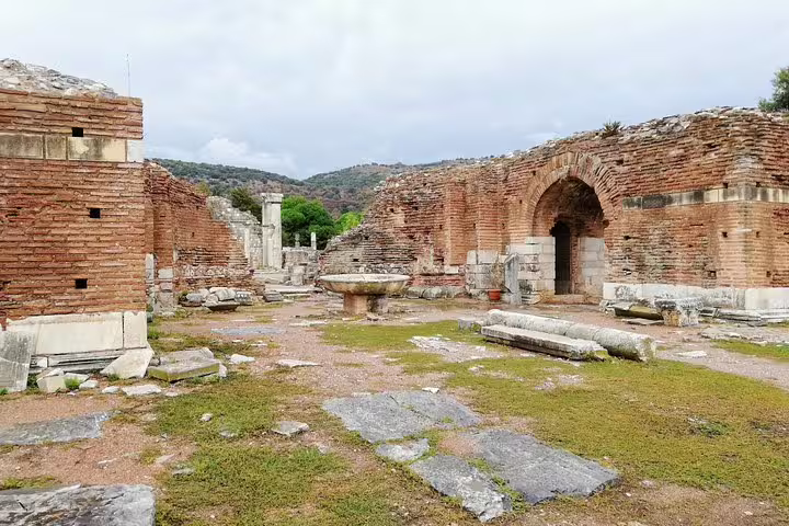 Brick arch and courtyard ruins at Ephesus on a full-day mini-group tour from Izmir, max 10 pax