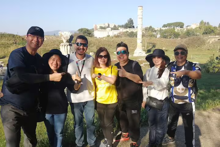 Happy small group of cruise travelers posing at Ephesus ruins on a 3–4 hour guided shore excursion