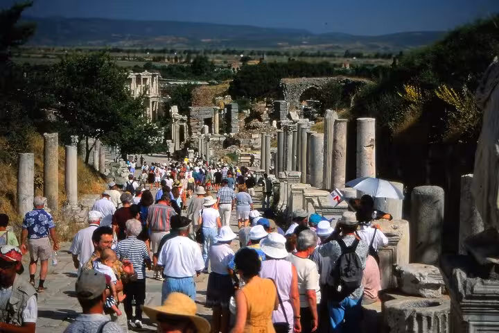 Crowds walking along Curetes Street in Ephesus ruins, guided Turkey itinerary from Istanbul to Pamukkale
