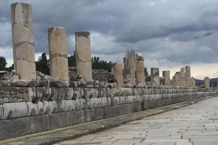 Ancient marble columns along Curetes Street in Ephesus ruins, part of private guided tour with lunch from Kusadasi