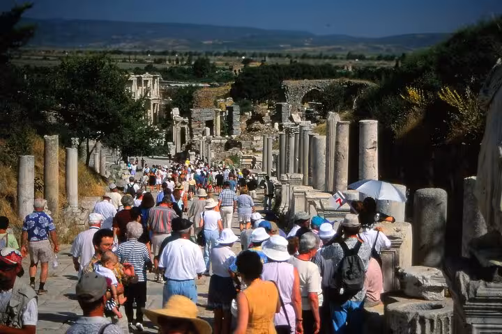 Crowds walking Curetes Street in Ephesus on a skip-the-line half-day private tour for cruise passengers from Kusadasi
