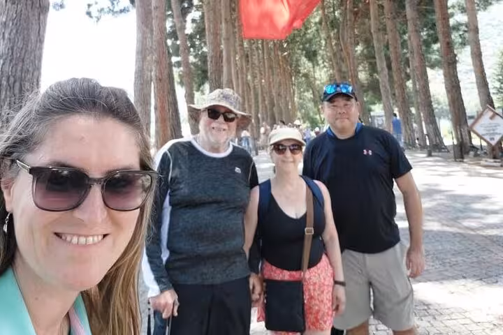 Travelers at House of Virgin Mary forest path on all inclusive private Ephesus tour from Kusadasi