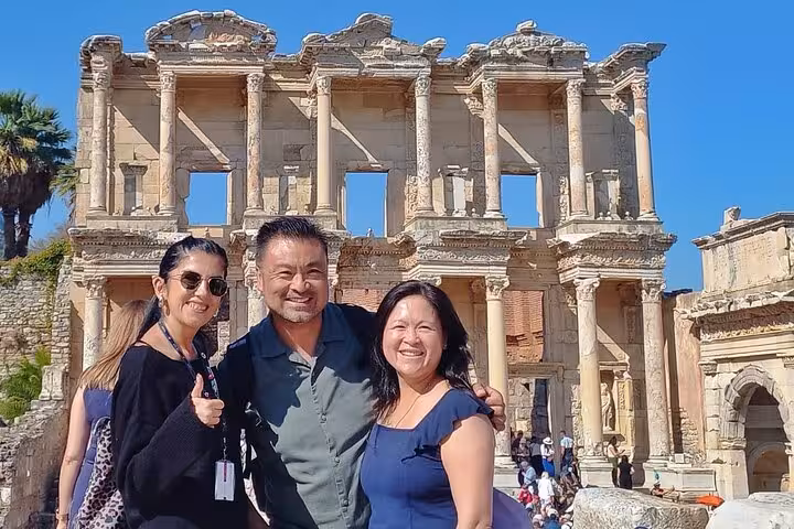 Guests pose at Ephesus Library of Celsus on Bodrum day tour, Turkey, small group sightseeing