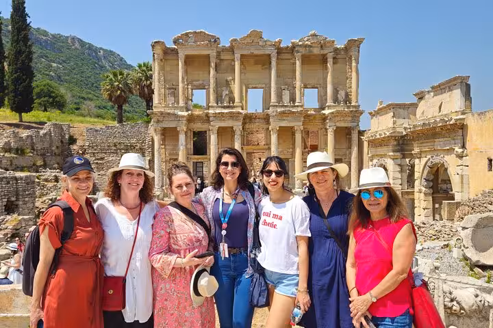 Travelers with guide posing at the Library of Celsus, Ephesus private tour from Izmir cruise port in Turkey