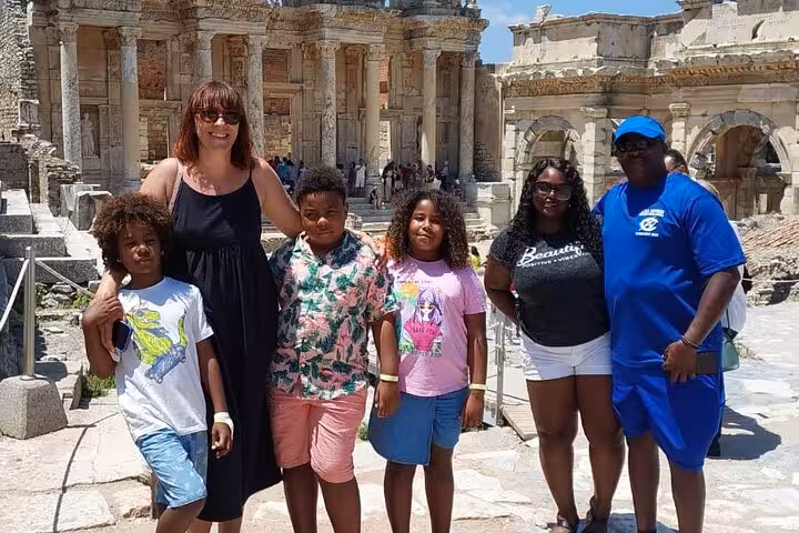 Family group photo at Ephesus Library of Celsus during half-day small group shore excursion from Kusadasi