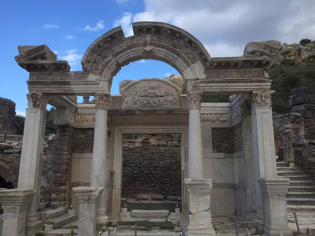 Ornate marble arch and columns at Ephesus ruins on all-inclusive private tour with Virgin Mary House and lunch