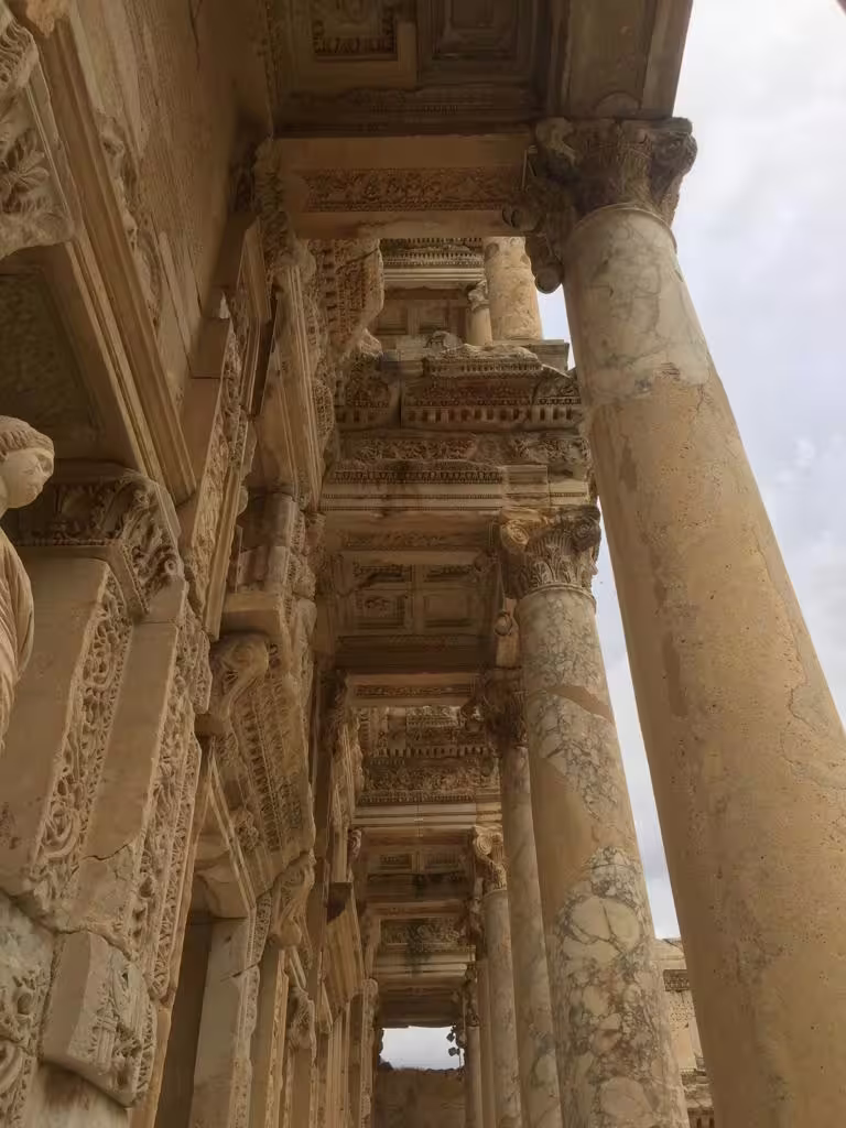 Close-up of ornate marble columns and carvings in Ancient Ephesus ruins on a private all-inclusive guided tour