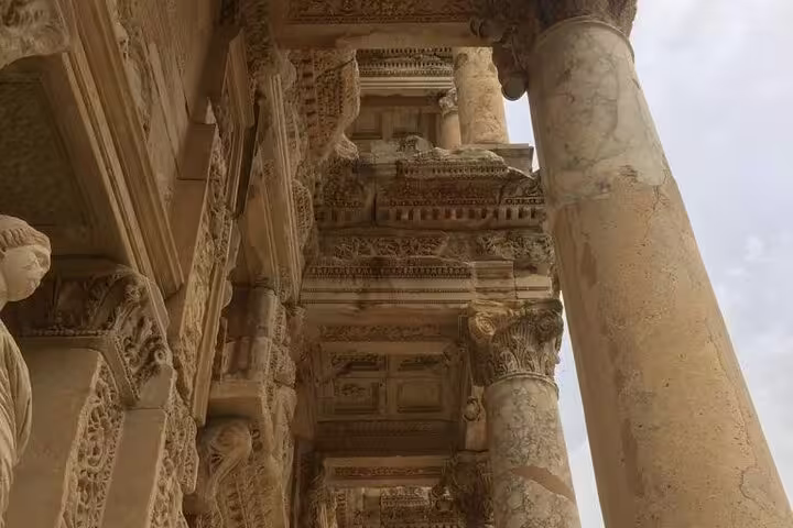 Close-up of ornate marble columns and carvings at Ephesus ruins on a private less-walking tour
