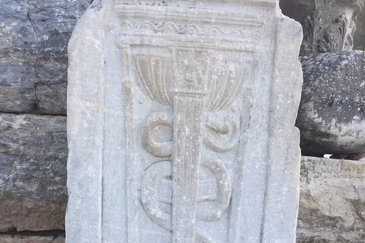 Close-up of carved marble relief at Ephesus archaeological site on private guided less walking shore excursion