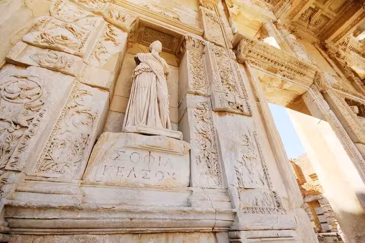 Carved marble reliefs and statue at Ephesus ancient city, highlight of 5-day Istanbul Ephesus Pamukkale tour