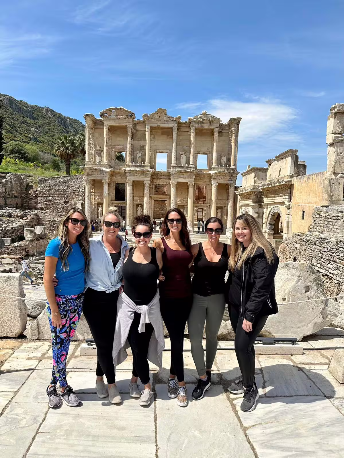 Group photo at Library of Celsus in Ephesus on Mary’s House guided tour, private service with no hidden fees