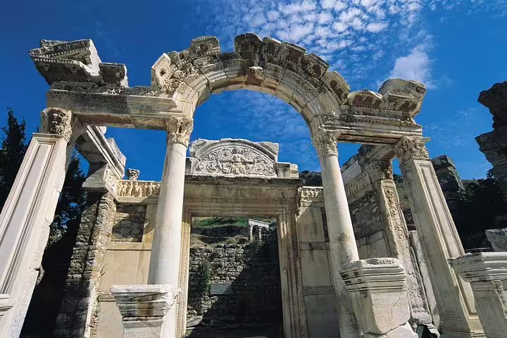 Ancient stone arch and columns at Ephesus ruins on guided tour to Mary's House, private no hidden fees