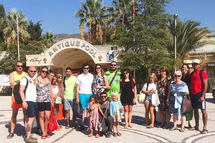 Group of tourists at Pamukkale's Antique Pool during 2-day Ephesus and Pamukkale tour from Istanbul.