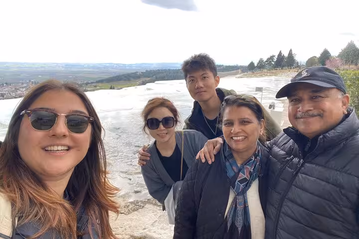 Group photo on Pamukkale white travertine terraces, part of 2-day Ephesus & Pamukkale tour from Istanbul