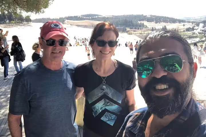 Tourists enjoying a sunny day at Pamukkale during the 2 Days Ephesus & Pamukkale Tour from/to Istanbul.