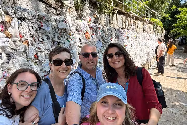 Travelers selfie by wish wall at House of Virgin Mary near Ephesus on 3-day Istanbul to Pamukkale and Didyma tour