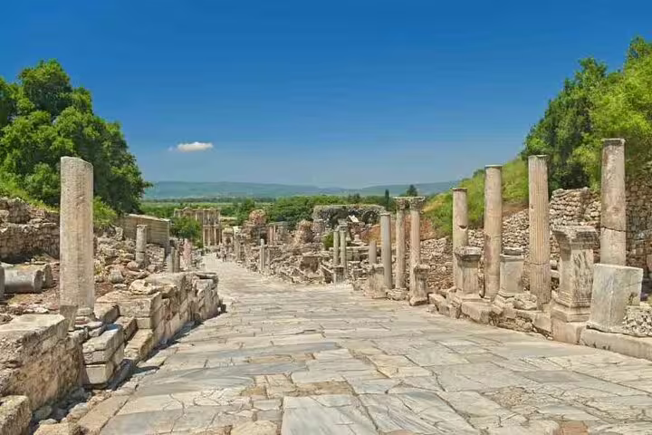 Explore the ancient marble streets of Ephesus on a private tour from Izmir Port, surrounded by historic columns and ruins.