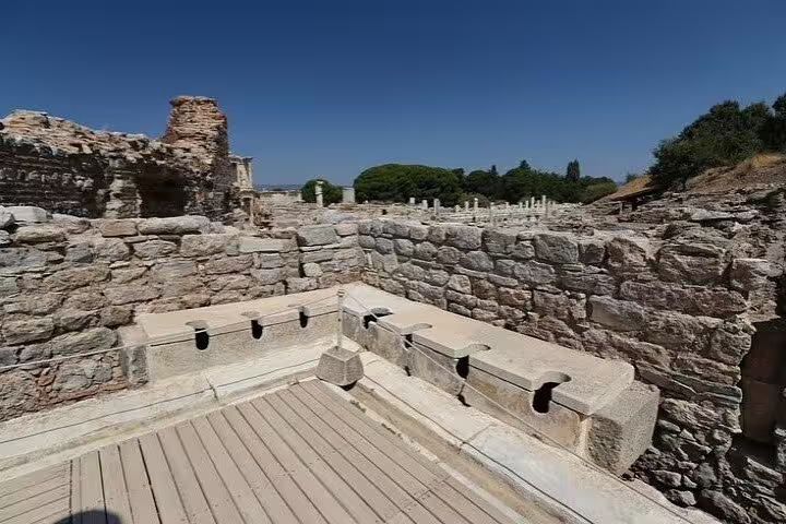 Ancient Ephesus Roman latrines ruins visit on private Ephesus tour from Kusadasi Port with shopping