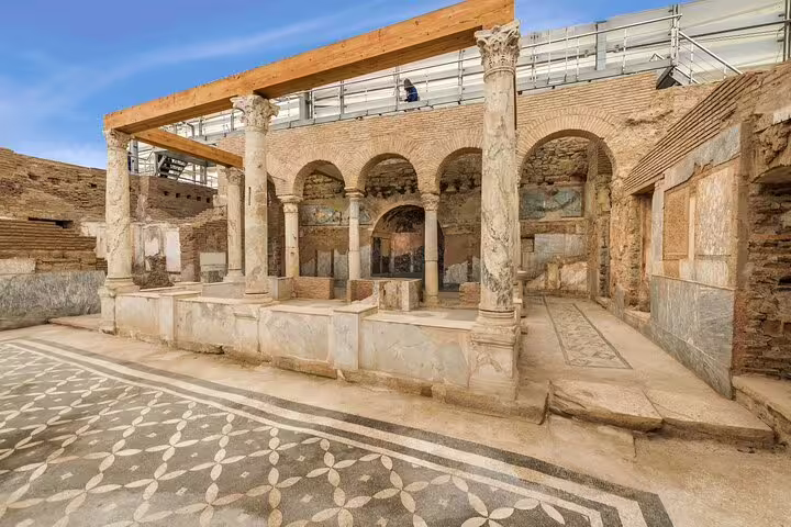 Restored Roman terrace houses in Ephesus with marble columns, key attraction on Ephesus & Wine Tasting Tour from Kusadasi.