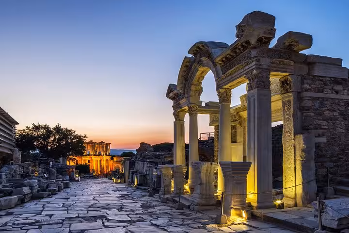 Twilight view of illuminated Ephesus ruins and arches on an all-inclusive private Kusadasi shore excursion
