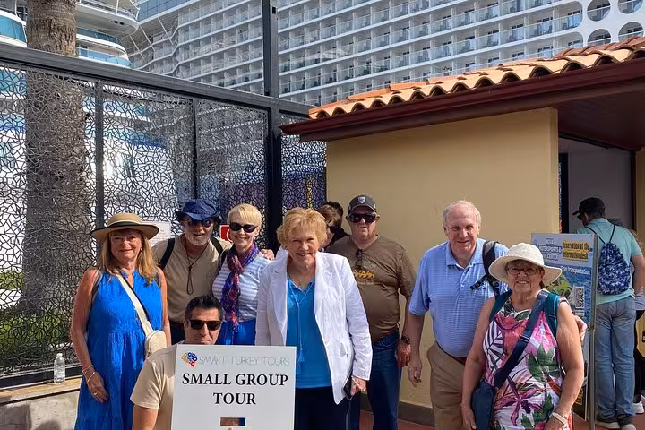 Small group shore tour guests at Kusadasi Port meeting point before half-day Ephesus guided visit in Turkey