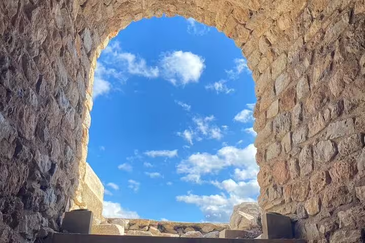 Stone arch window framing blue sky at Ephesus ancient city, scenic stop on private tour to Sirince and Artemis Temple