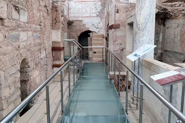 Glass walkway inside Ephesus Terrace Houses ruins, visited on 4–6 hour private or group tour with no hidden fees