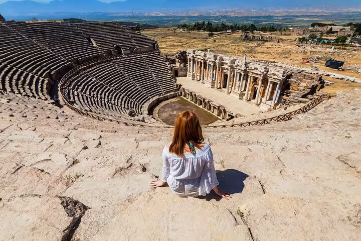 Traveler overlooking Ephesus Great Theatre on 2-day 1-night tour from Istanbul by plane in Turkey